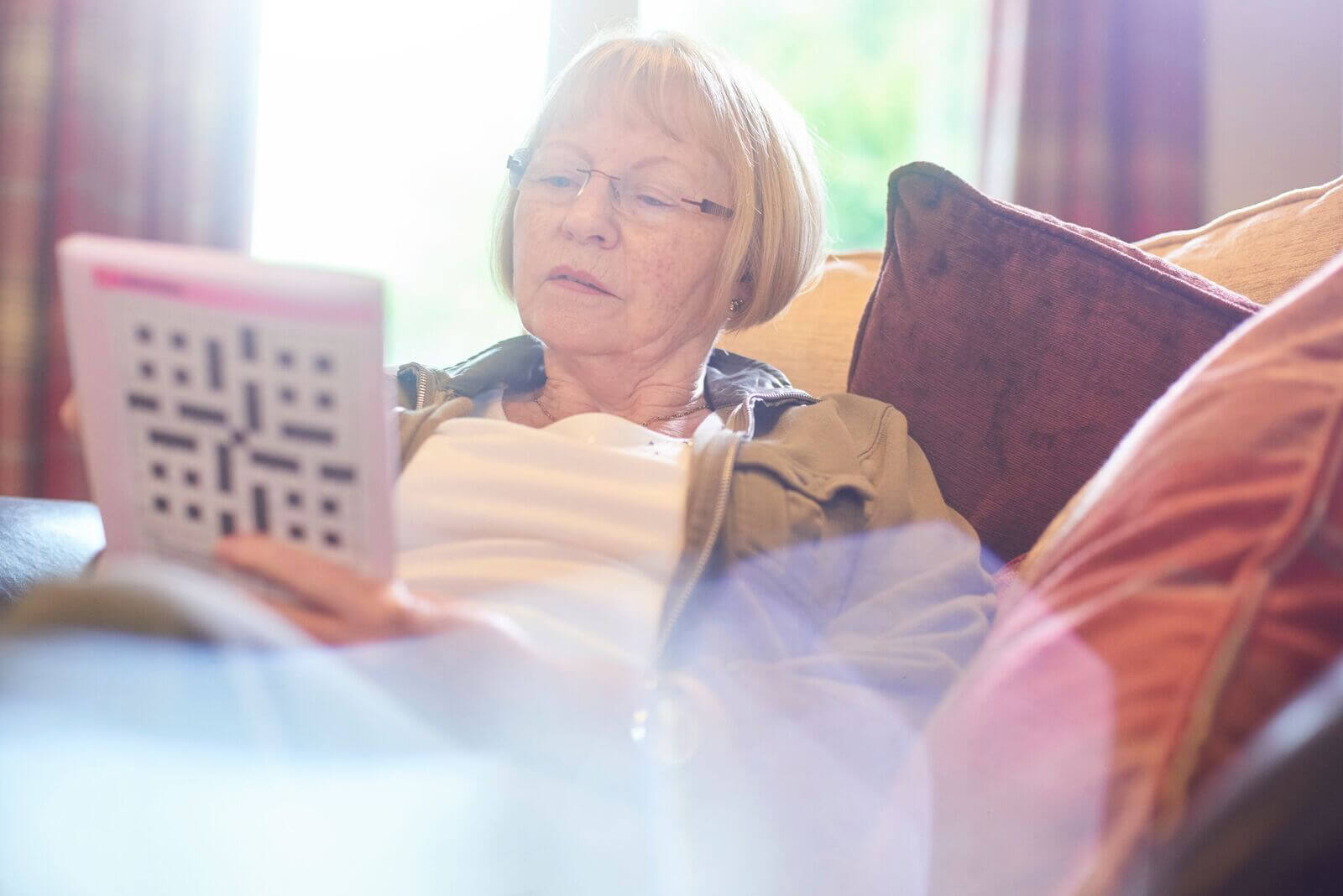 Senior woman playing crossword