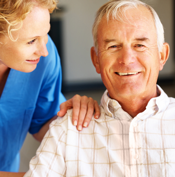 caregiver smiling at senior patient