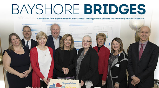 Bayshore staff hodling $30,000 donation check for Hospice Greater Saint John