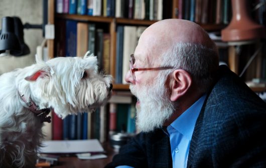 Senior man talking to dog