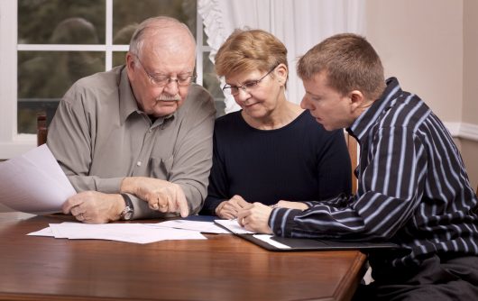 Financial advisor with senior couple