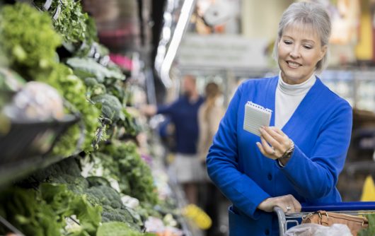 senior woman shopping with grocery list