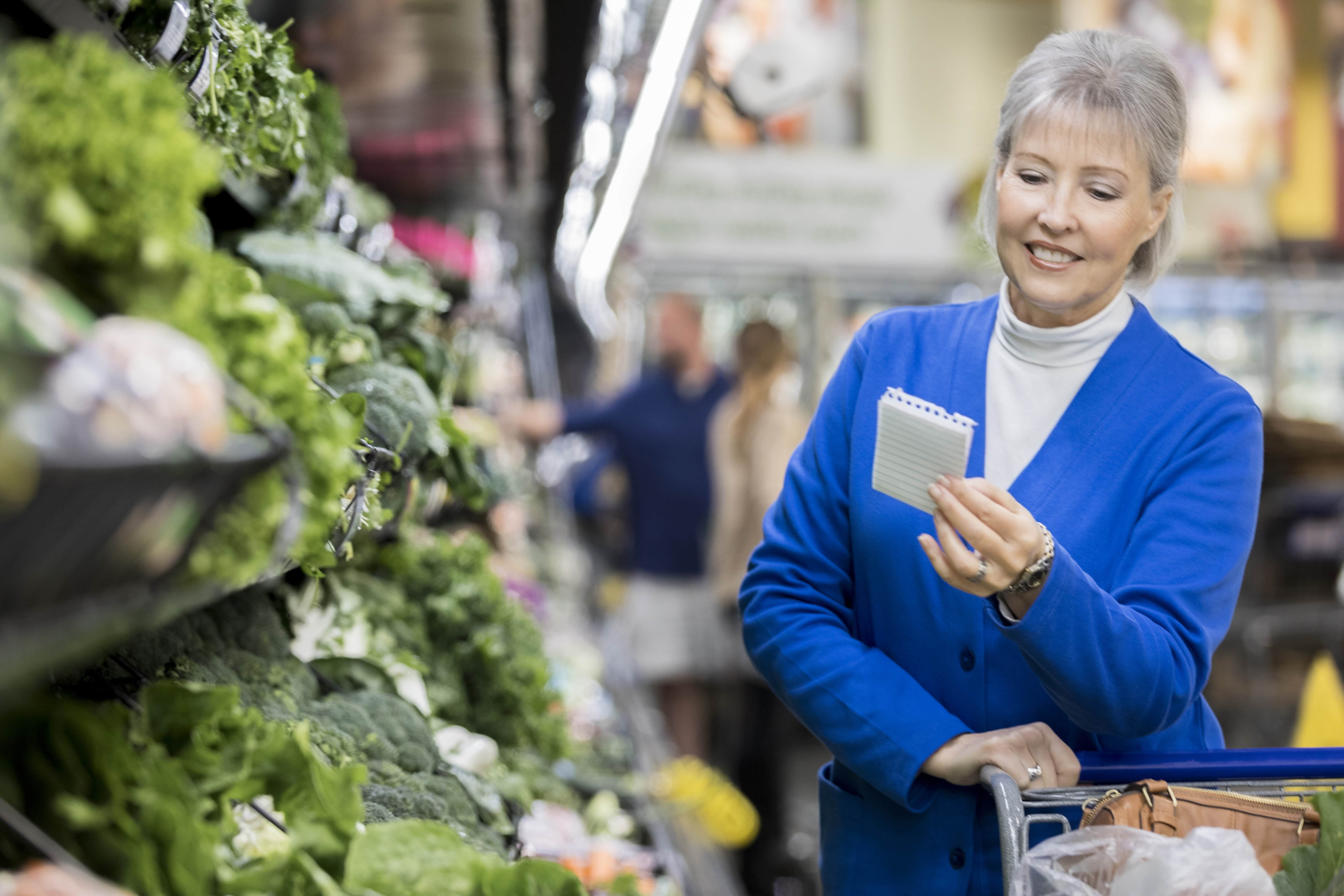 senior woman shopping with grocery list