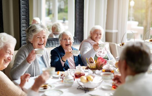 group of senior women having tea