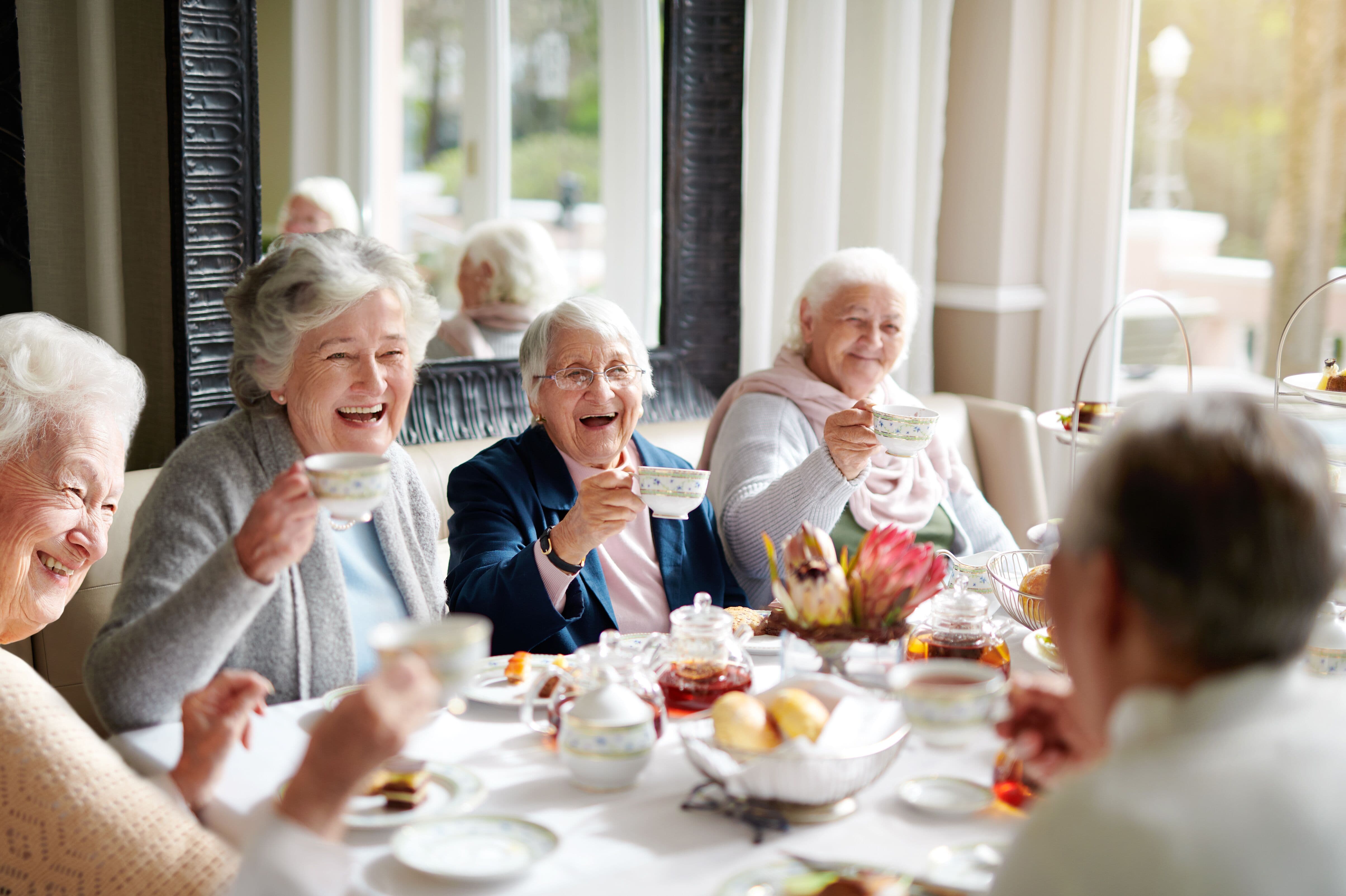 group of senior women having tea