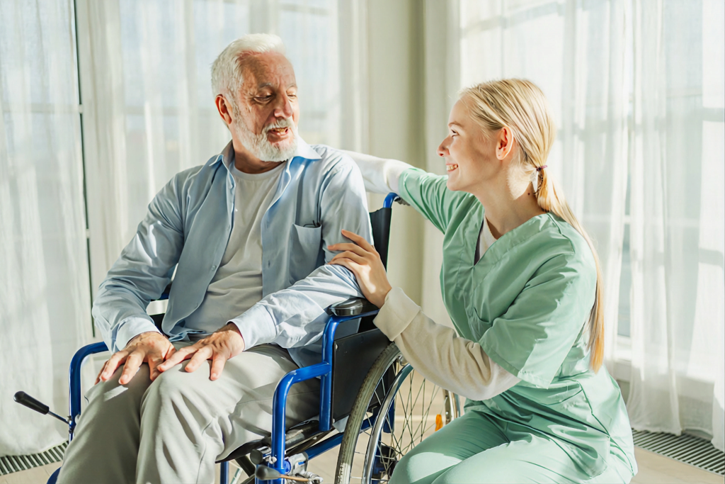 Nurse taking care of an elderly man in a wheel chair