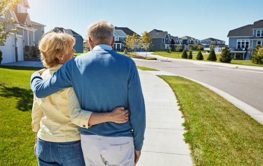 Senior couple taking walk in neighbourhood