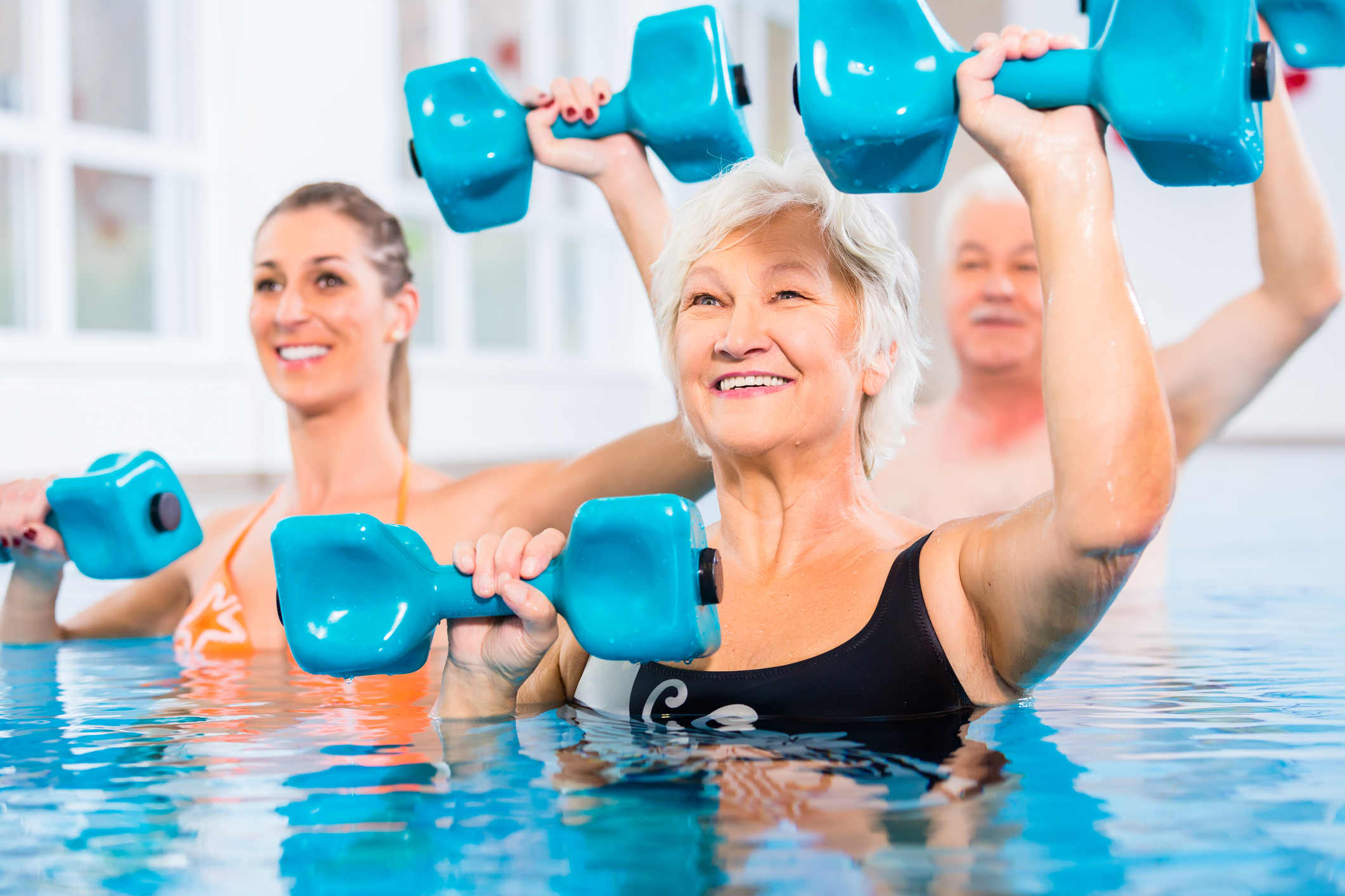 Seniors doing water gymnastics