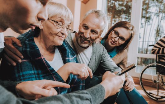 Family looking at phone together