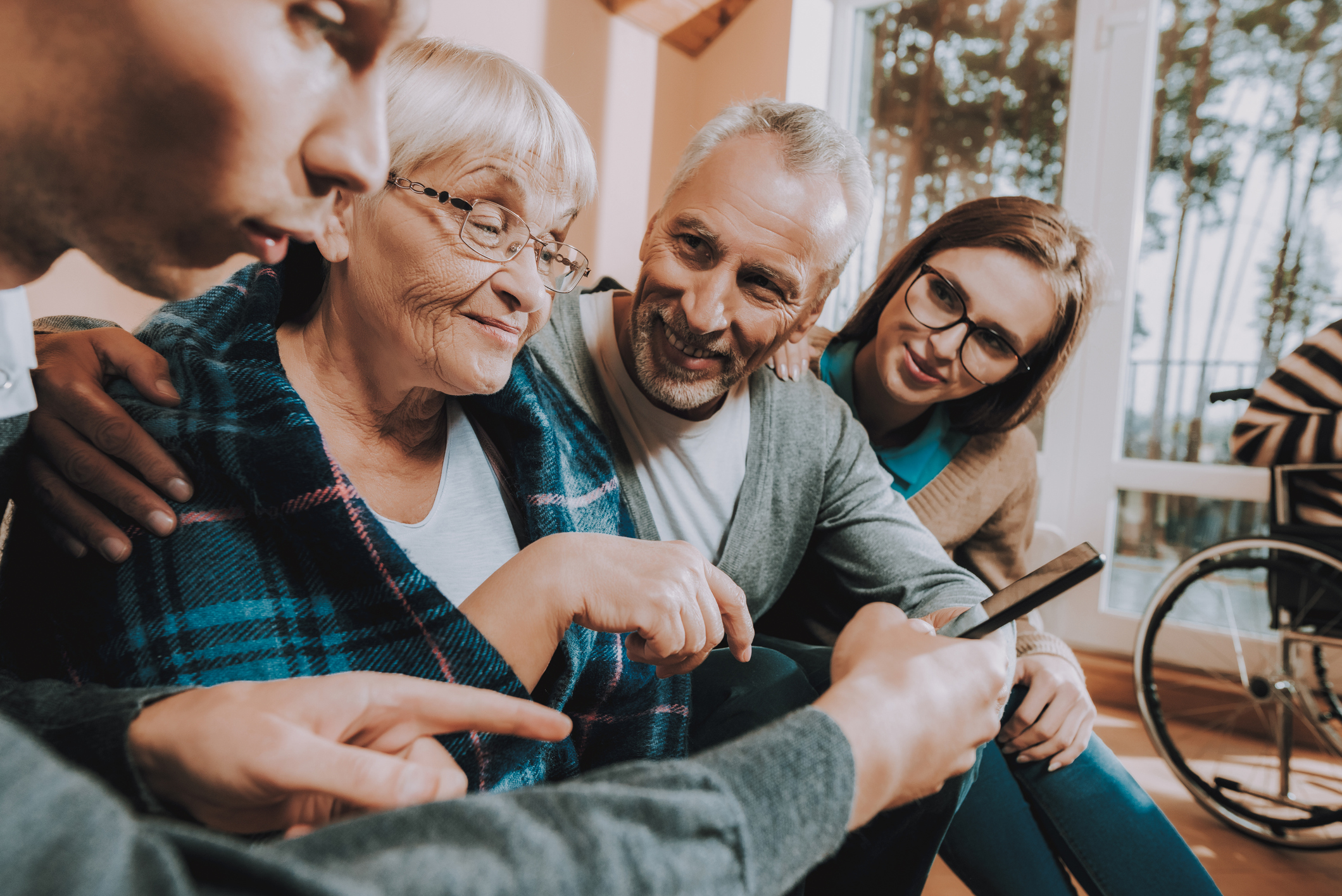 Family looking at phone together