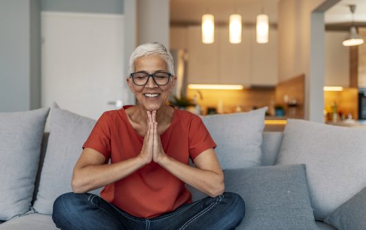 Woman meditating at home