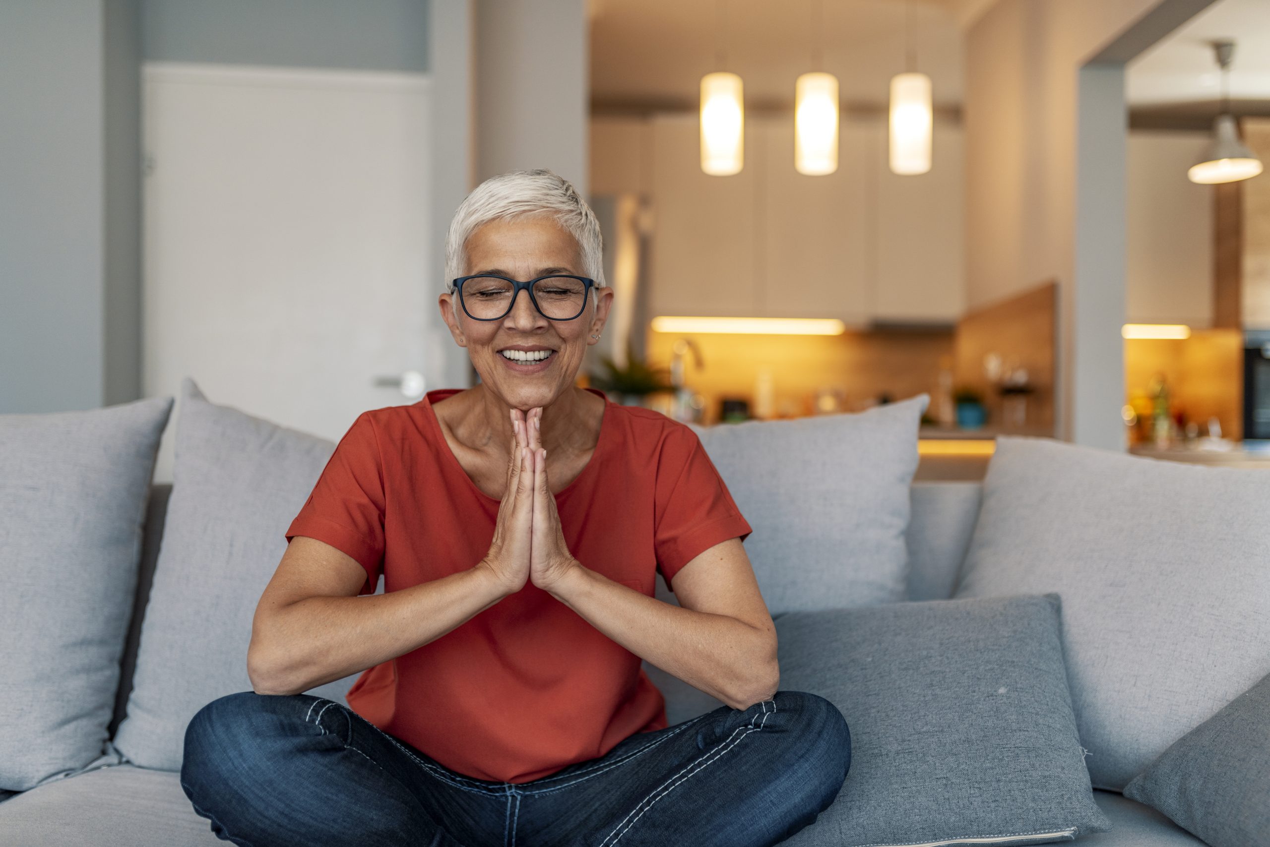 Woman meditating at home