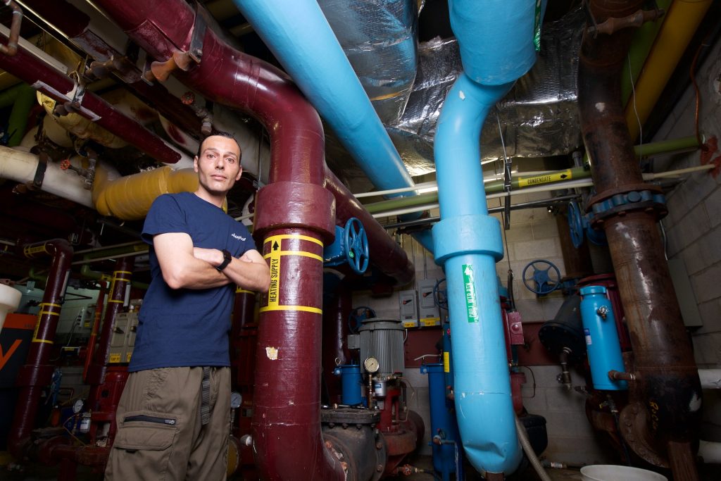 Roger Rebelo standing in front of pipes