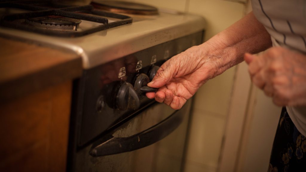 Close up of woman hands setting temperature.