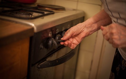 Close up of woman hands setting temperature.