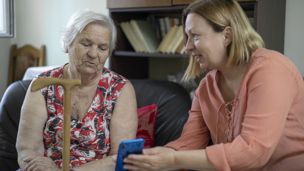 Daughter introducing her mother to the new technology