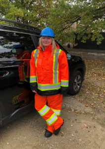 Woman wearing protective safety uniform.