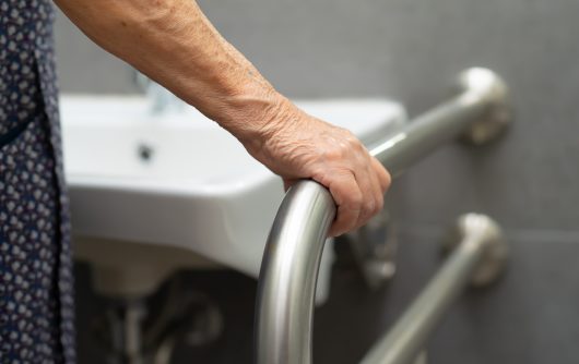 Asian senior or elderly old lady woman patient use toilet bathroom handle security in nursing hospital ward : healthy strong medical concept.