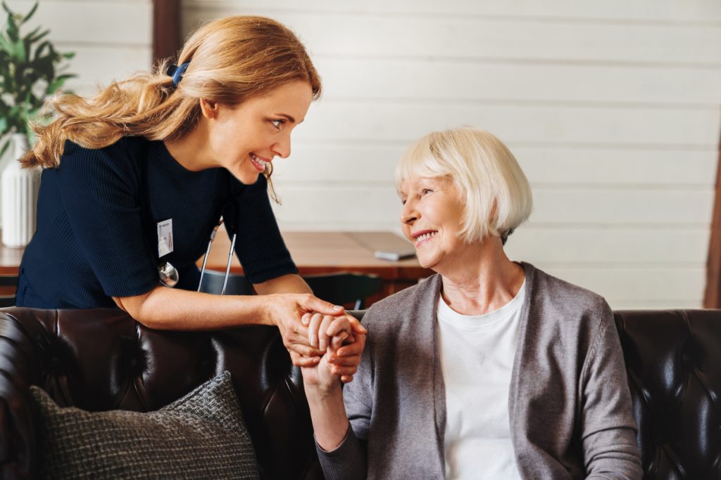 In-Home Nursing Services - Caregiver assisting senior woman