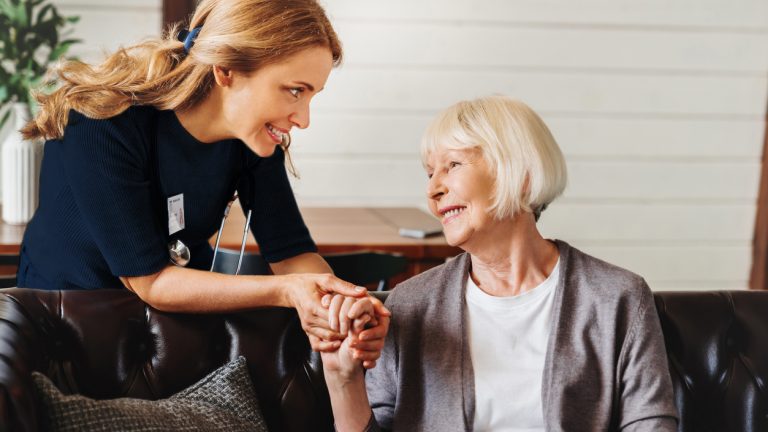 In-Home Nursing Services - Caregiver assisting senior woman