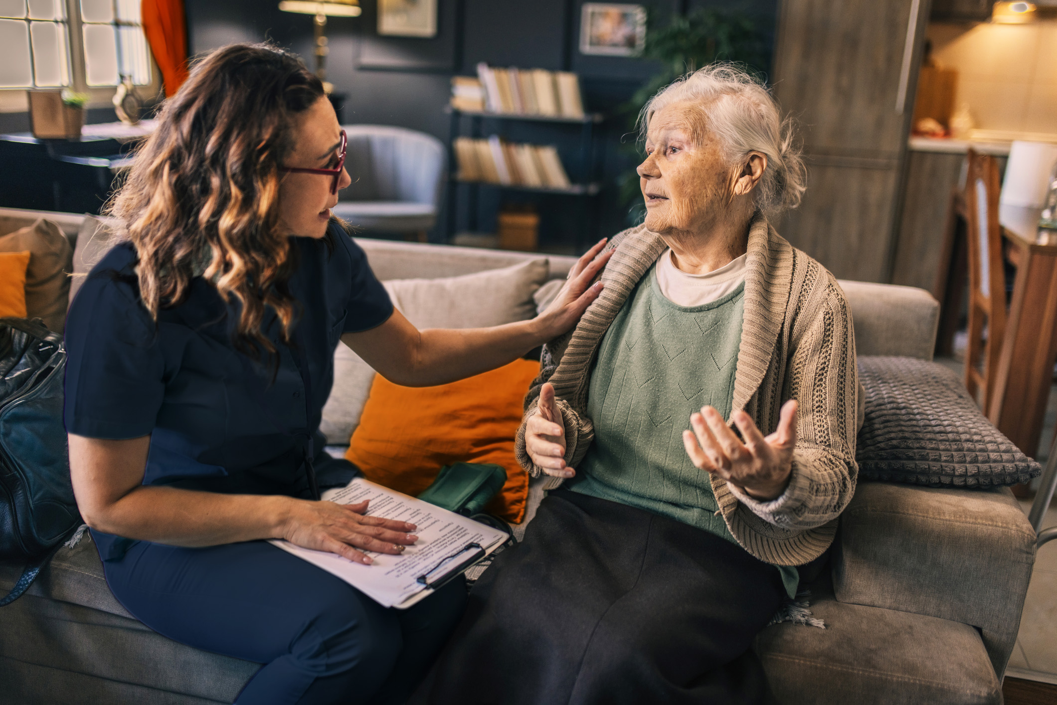 Bayshore Home Health - Caregiver talking to a senior woman