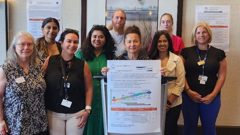 Bayshore Care @ Home Team holding up sign